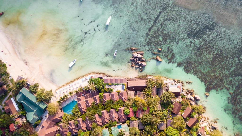 an aerial view of a resort on the beach at Secret Place Hotel and Restaurant in Haad Yao