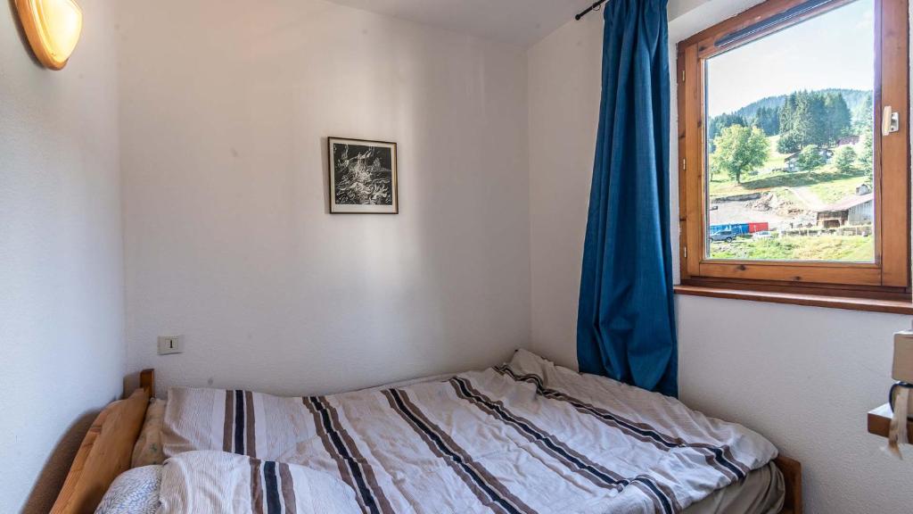Postel nebo postele na pokoji v ubytování Les Sitelles - 18 - Belle vue Appart 6 pers