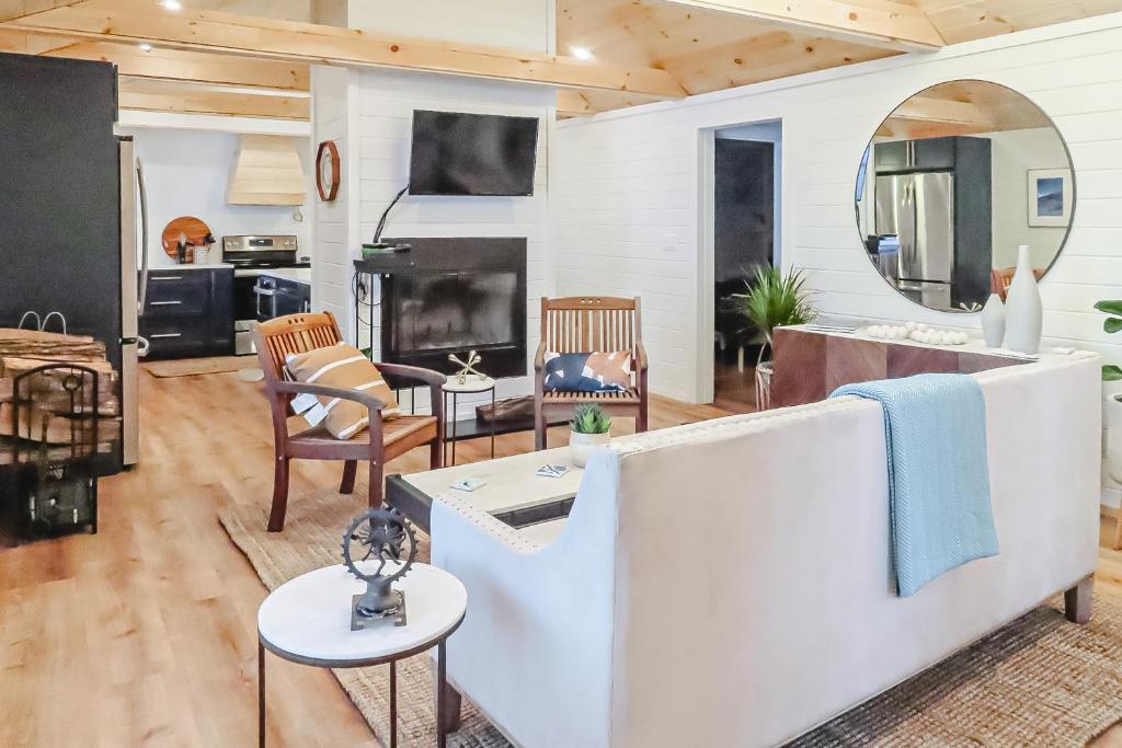 a living room with a couch and a table at Lake Winni Cottage in Moultonborough