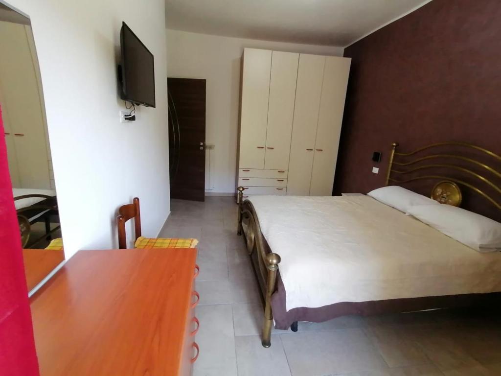 A bed or beds in a room at Al Belvedere
