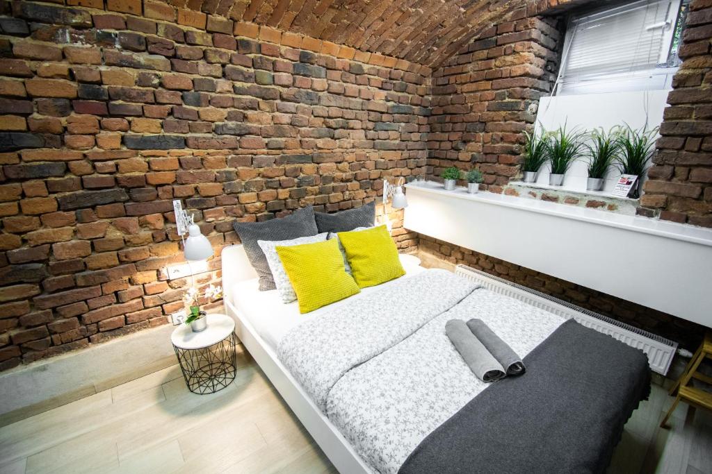 Posteľ alebo postele v izbe v ubytovaní LION apartments