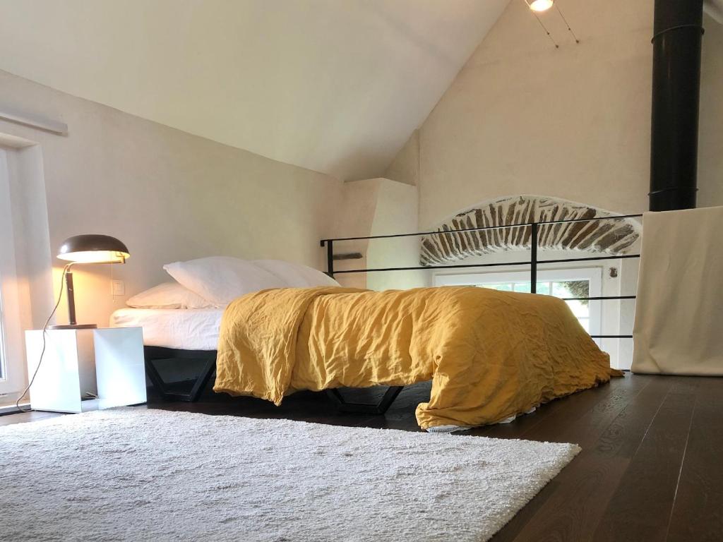Postel nebo postele na pokoji v ubytování Cottage Les Rochers
