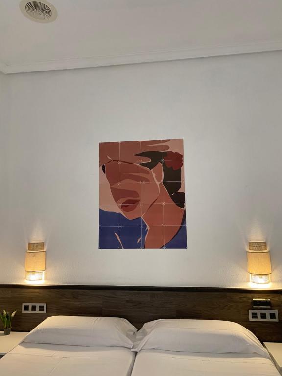 Cama o camas de una habitación en Pensión Donostiarra