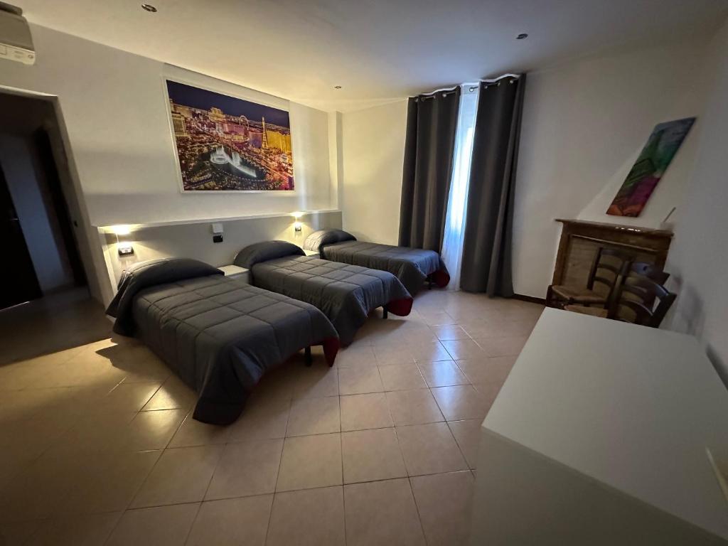 Ένα ή περισσότερα κρεβάτια σε δωμάτιο στο Hotel Duca di Tromello