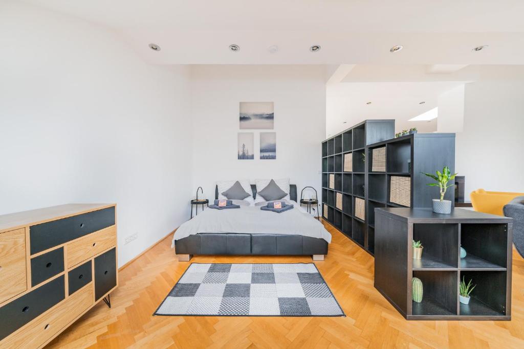 Łóżko lub łóżka w pokoju w obiekcie Penthouse apartment - Sauna - Terrasse - Kamin - AC