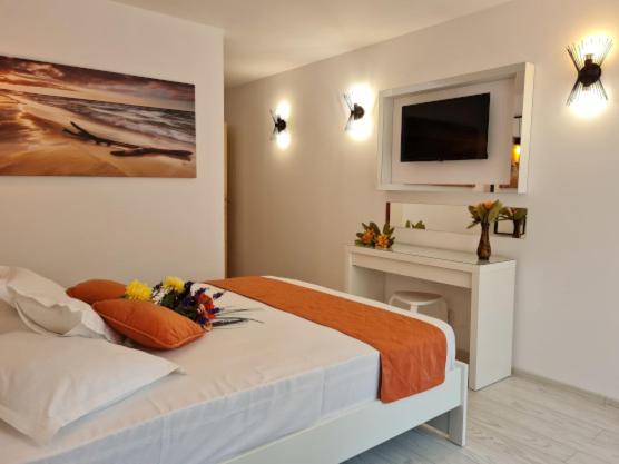 Postel nebo postele na pokoji v ubytování Hotel Sunquest