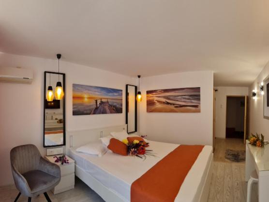Postel nebo postele na pokoji v ubytování Hotel Sunquest