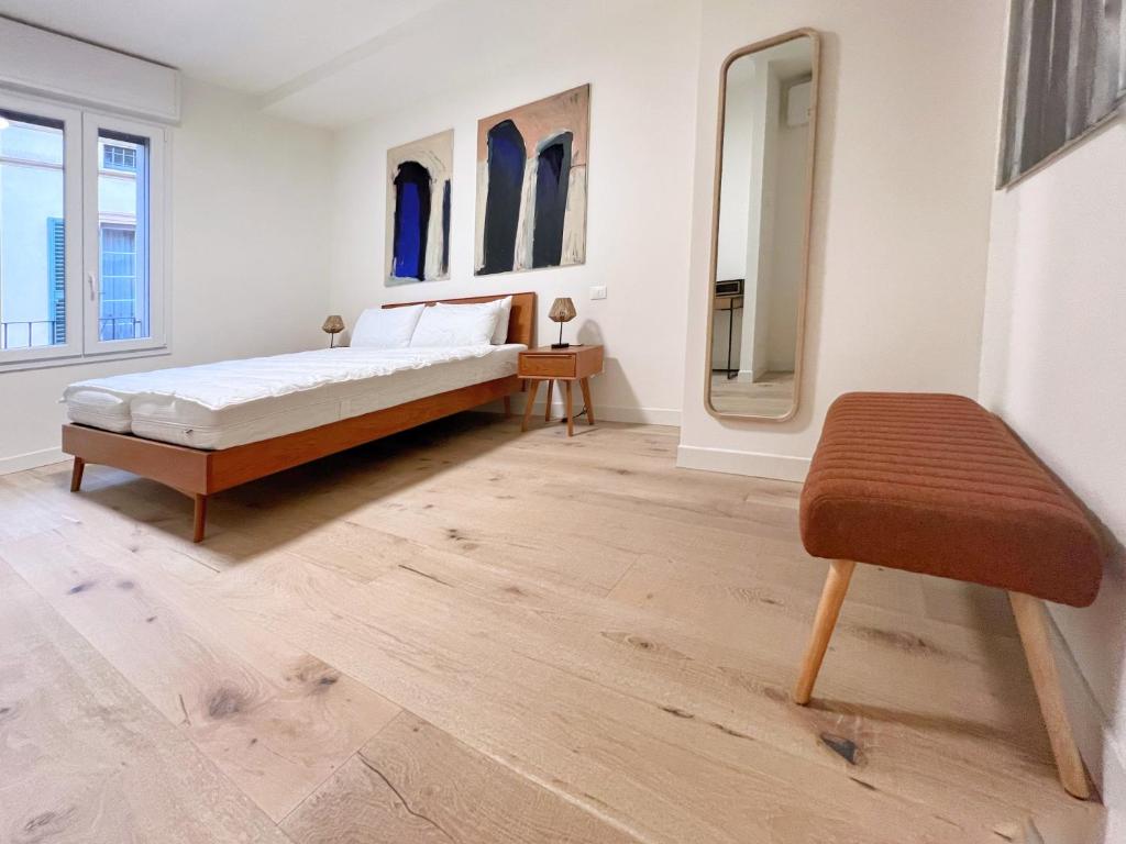 A bed or beds in a room at UR NEST San Giorgio