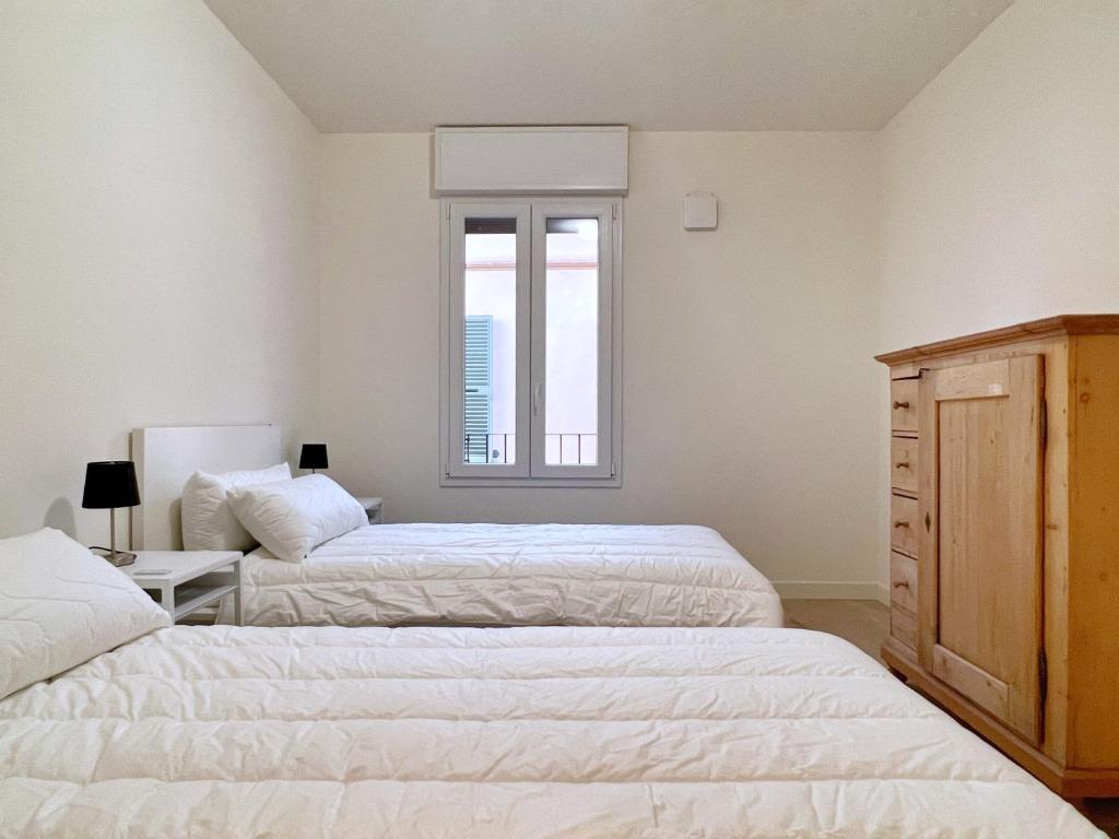 A bed or beds in a room at UR NEST San Giorgio