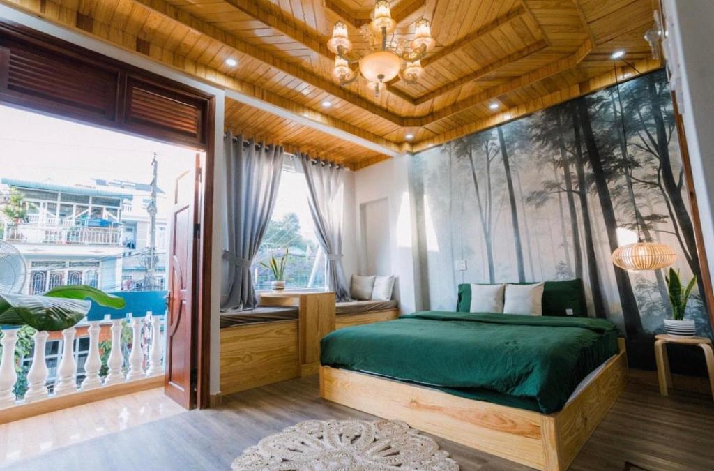 Una cama o camas en una habitación de Nấm Home