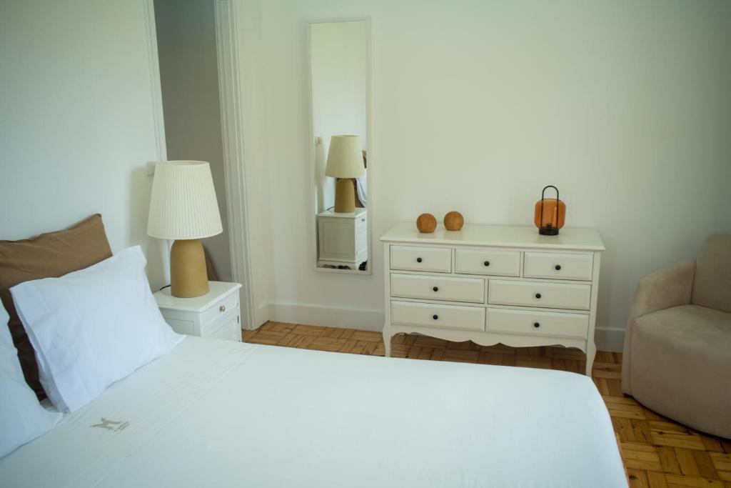 Postel nebo postele na pokoji v ubytování 3 Marias Residence