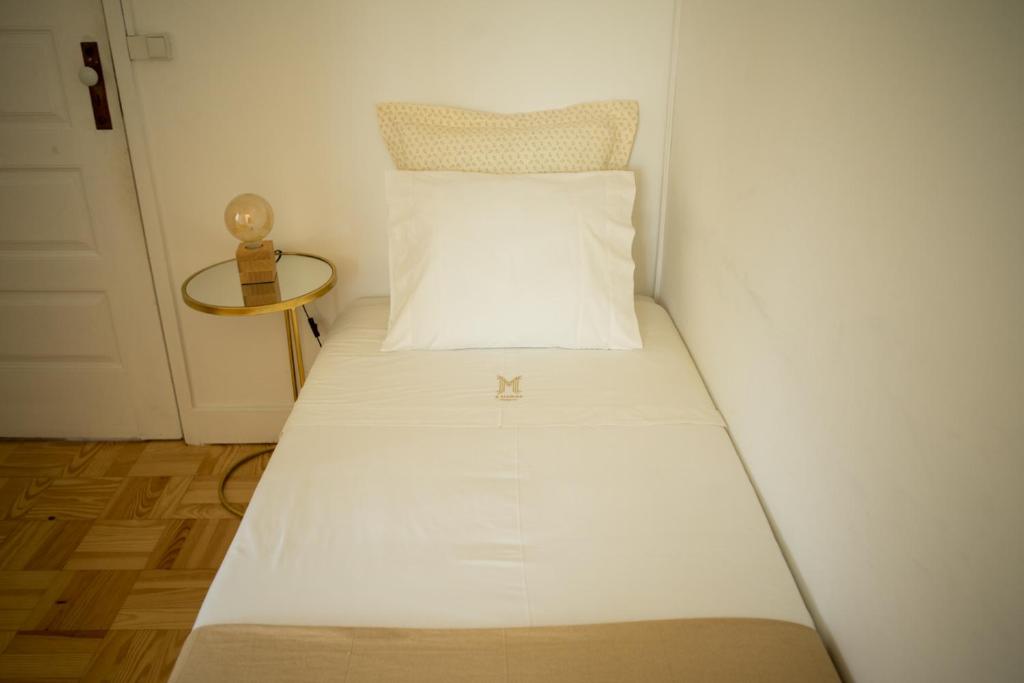 Postel nebo postele na pokoji v ubytování 3 Marias Residence