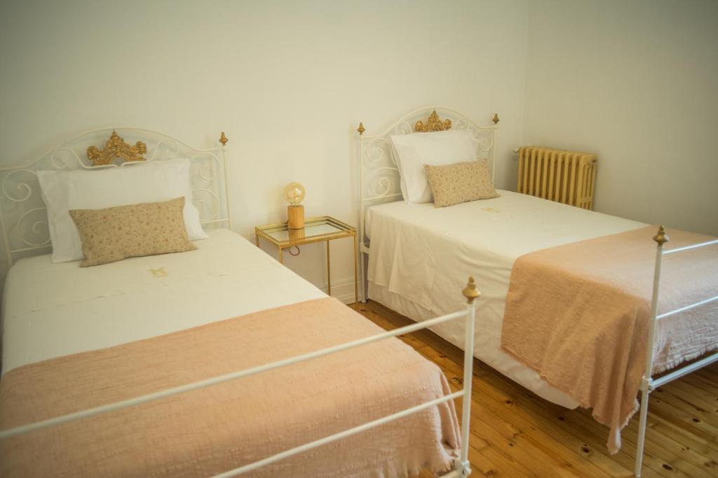 Postel nebo postele na pokoji v ubytování 3 Marias Residence