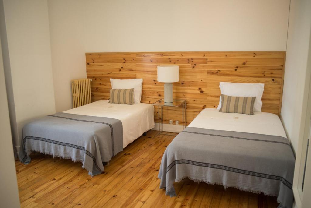 Postel nebo postele na pokoji v ubytování 3 Marias Residence