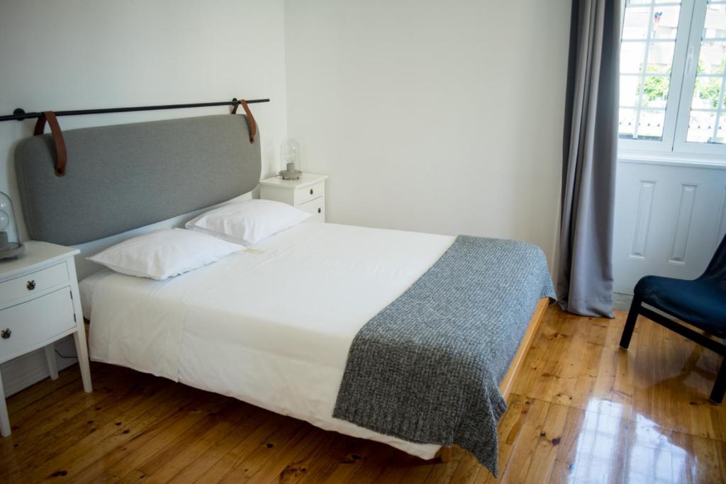 Postel nebo postele na pokoji v ubytování 3 Marias Residence