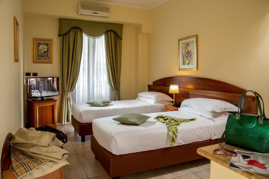 Postel nebo postele na pokoji v ubytování Marini Park Hotel