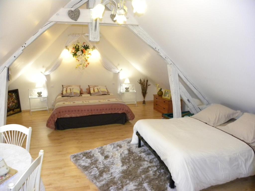 Postel nebo postele na pokoji v ubytování Maison d'Hôtes La Quèrière