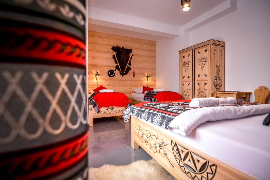 Postel nebo postele na pokoji v ubytování "CZARNA TURNIA"-Apartamenty
