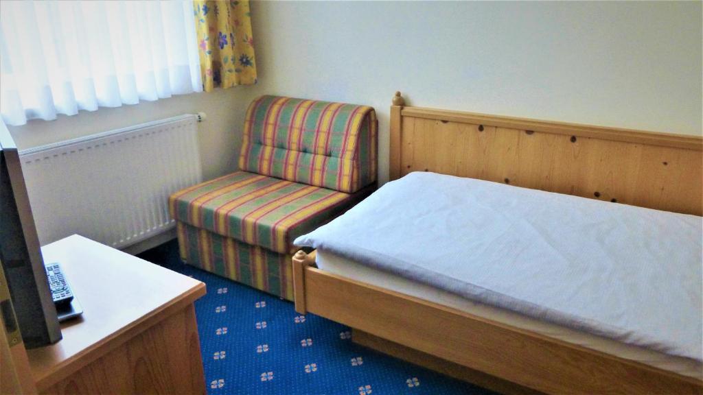 Postel nebo postele na pokoji v ubytování Hotel - Café - Konditorei Schröckmayr-Kastner