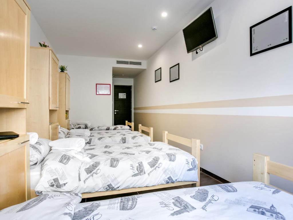 Postel nebo postele na pokoji v ubytování Hostel Moving