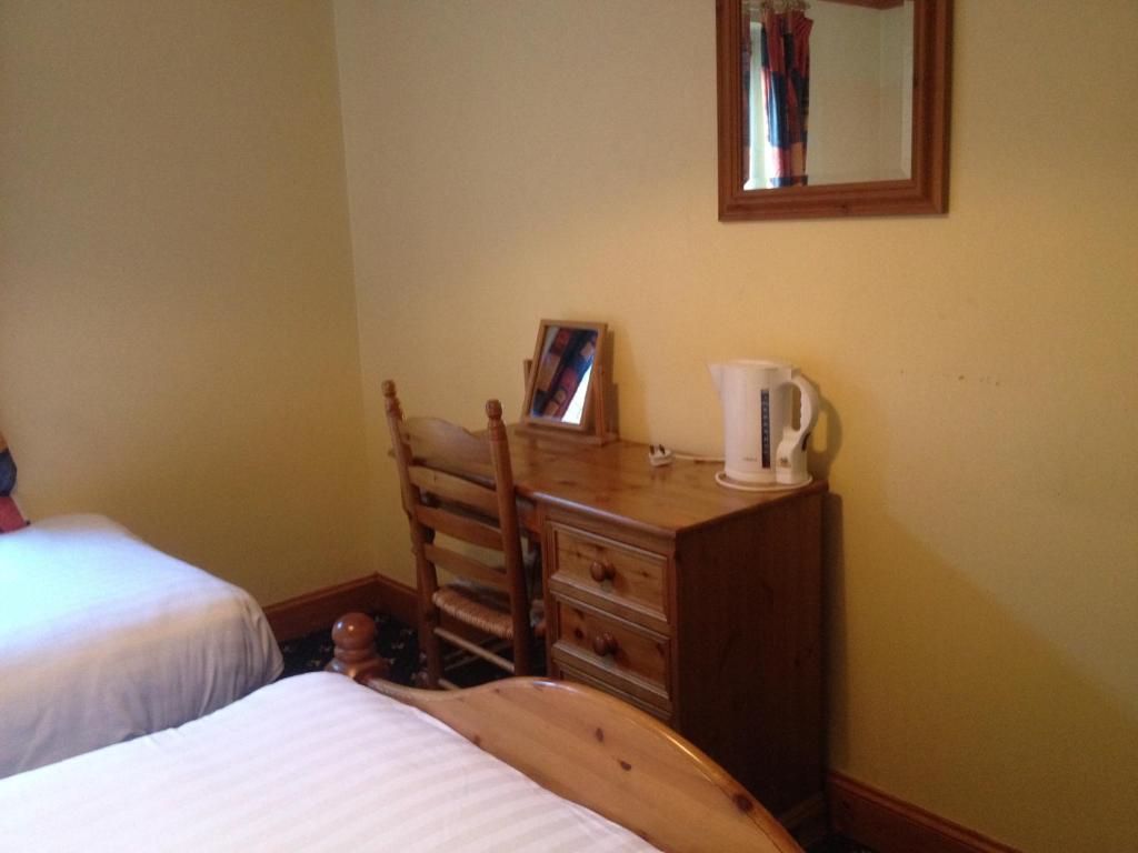 Postel nebo postele na pokoji v ubytování Twin Lions Hotel