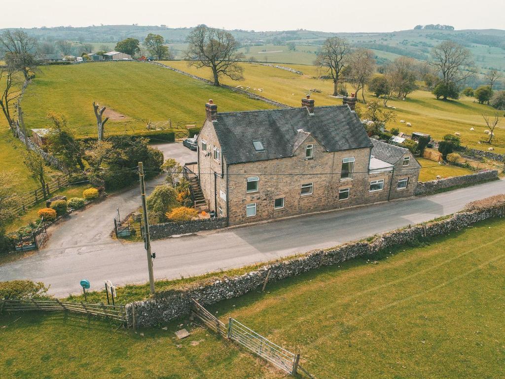 an aerial view of an old stone house on a road at Hillcrest House in Ashbourne
