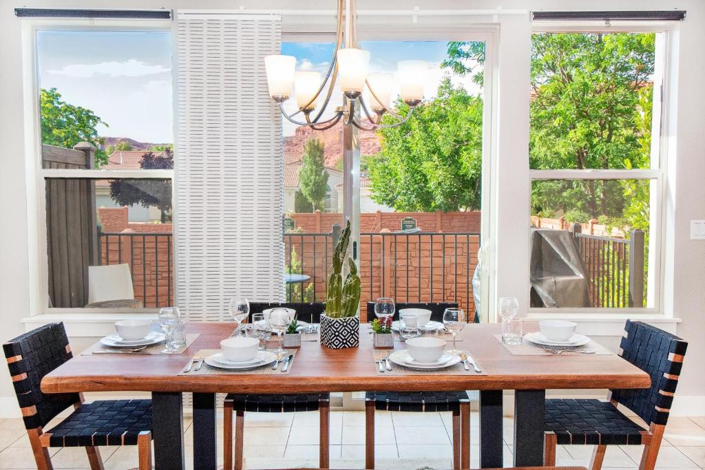 a dining room with a wooden table and chairs at Entrada at Moab 624 and 632 in Moab