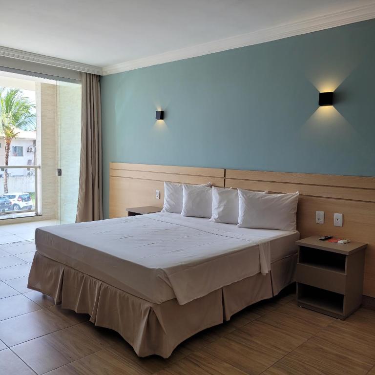 Postel nebo postele na pokoji v ubytování Porto Mar Hotel