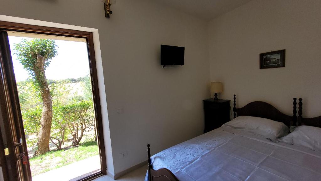 Posteľ alebo postele v izbe v ubytovaní Agriturismo Poggio la Lodola