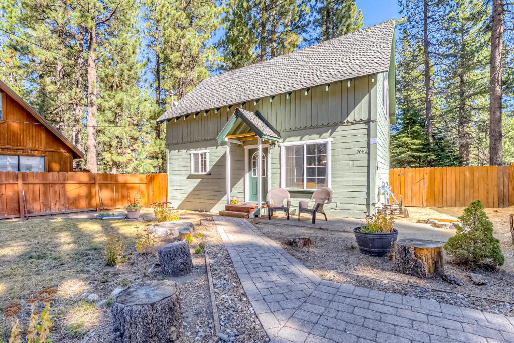 a tiny house with a patio and a fence at Foxglove Terrace in South Lake Tahoe