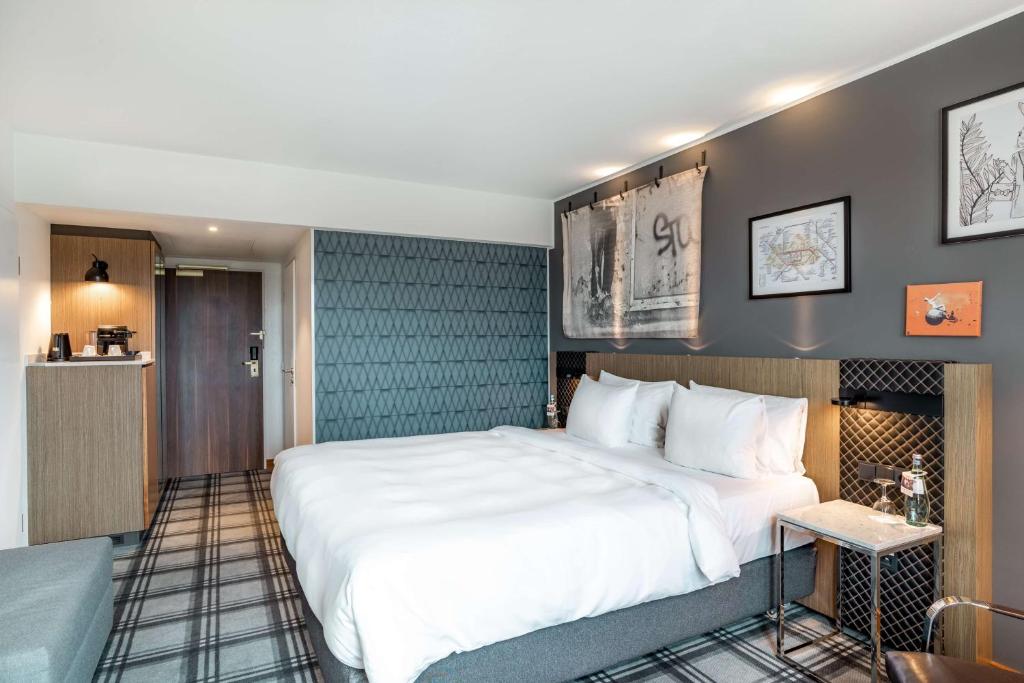 Postel nebo postele na pokoji v ubytování Radisson Blu Hotel Karlsruhe