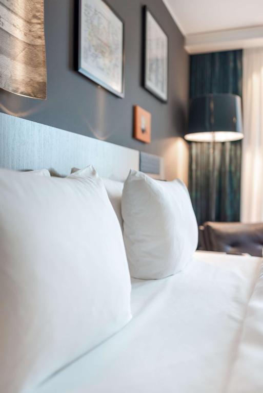Postel nebo postele na pokoji v ubytování Radisson Blu Hotel Karlsruhe