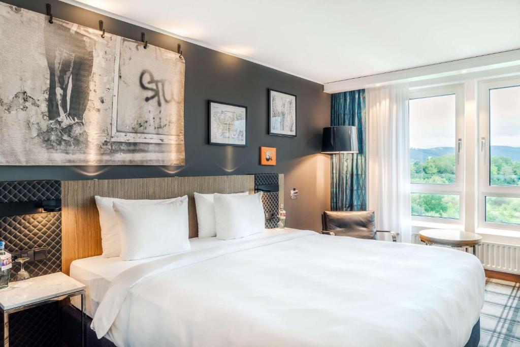 Postel nebo postele na pokoji v ubytování Radisson Blu Hotel Karlsruhe