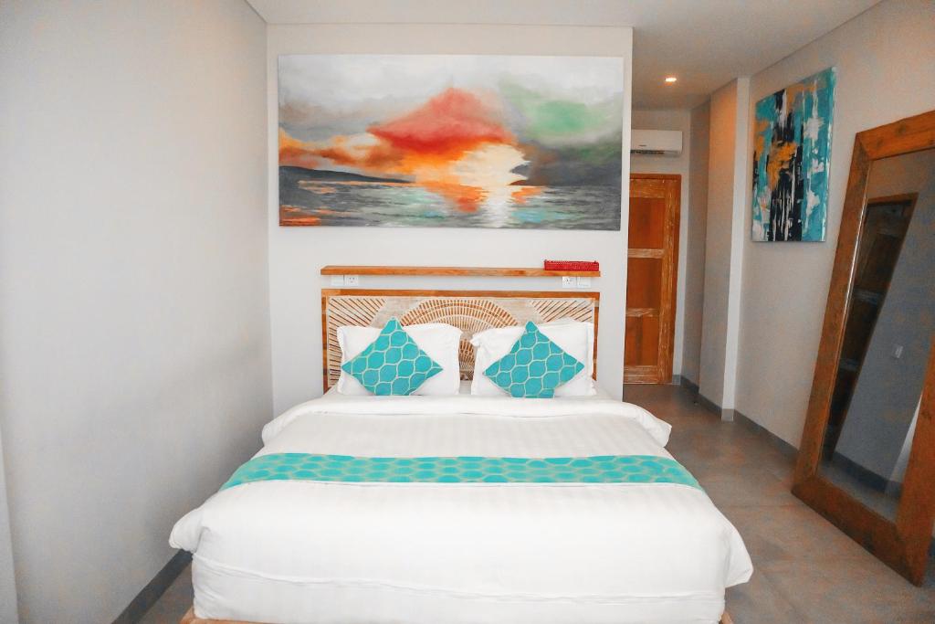 Harbour Komodo Hotel房間的床