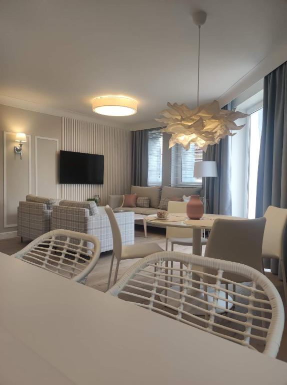 Televízia a/alebo spoločenská miestnosť v ubytovaní ForCity Apartment
