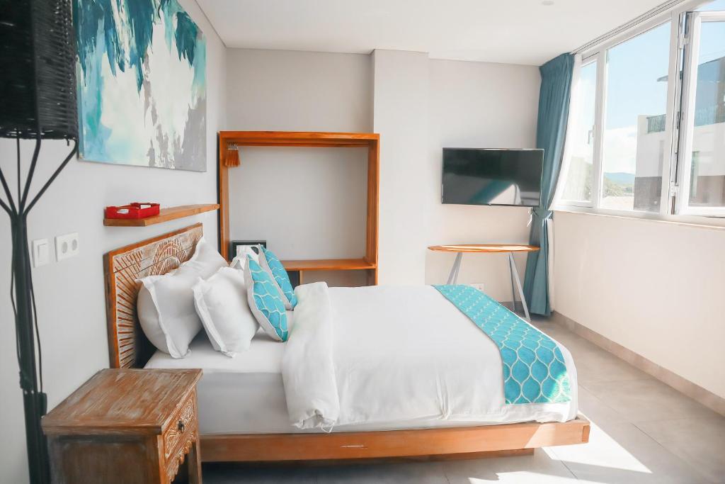 Harbour Komodo Hotel房間的床