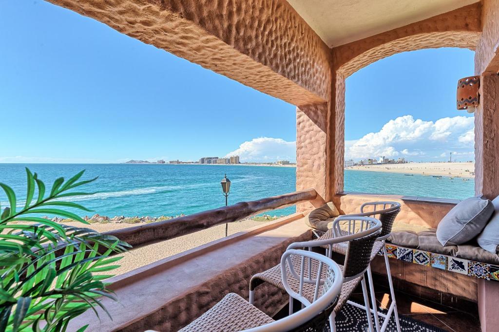a room with a view of the beach and the ocean at Marina Pinacate B-201 in Puerto Peñasco