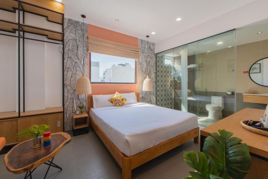 Postel nebo postele na pokoji v ubytování Shoho Hotel Nha Trang