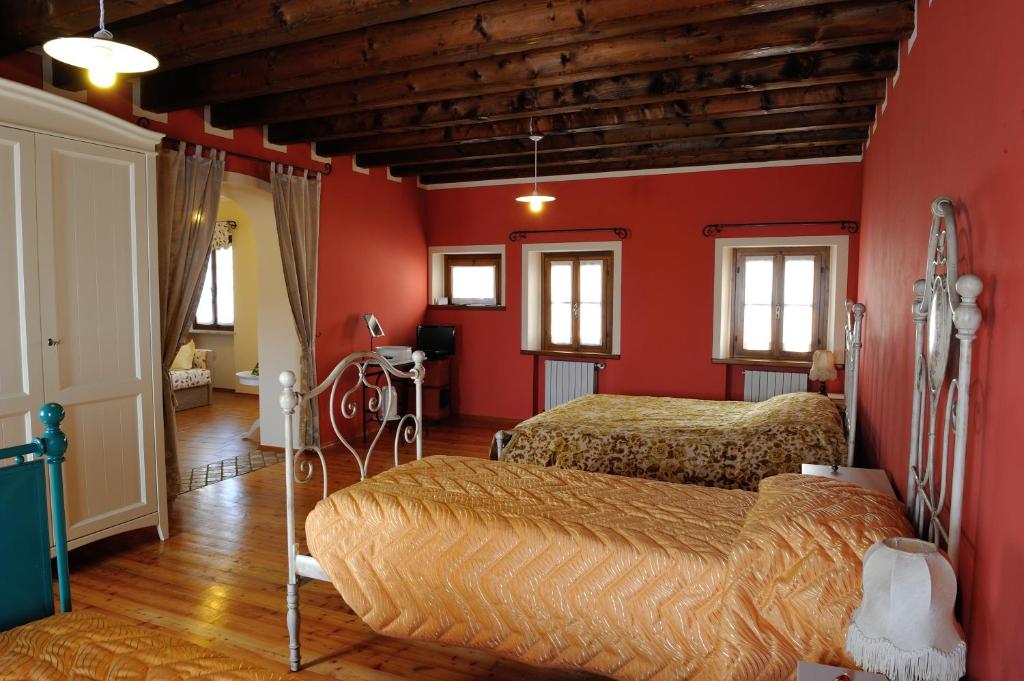 Postel nebo postele na pokoji v ubytování Agriturismo Crodi