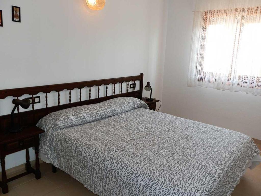 Posteľ alebo postele v izbe v ubytovaní Vacaciones ideales: Casa cerca del mar con piscina privada, wifi, aire opcional y mascotas bienvenidas - ES-184-34
