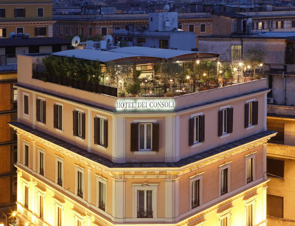 a building with a sign on top of it at Hotel dei Consoli Vaticano in Rome