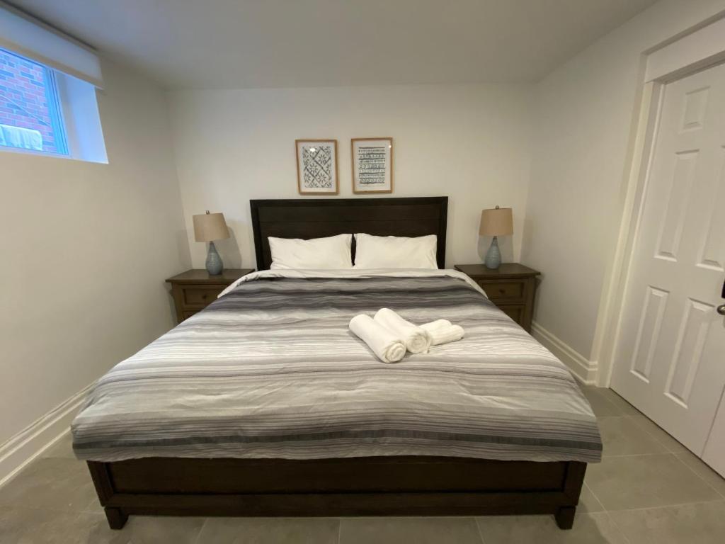 a bedroom with a bed with two towels on it at Yorkmills and Bayview !B Spacious and Stylish Private Bdr with Shared Bathroom in Toronto