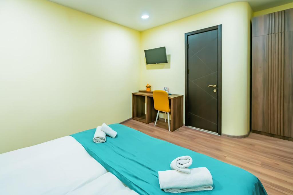 Postel nebo postele na pokoji v ubytování Hotel Classic Suites