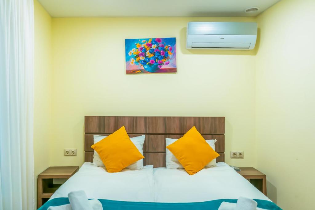 Postel nebo postele na pokoji v ubytování Hotel Classic Suites