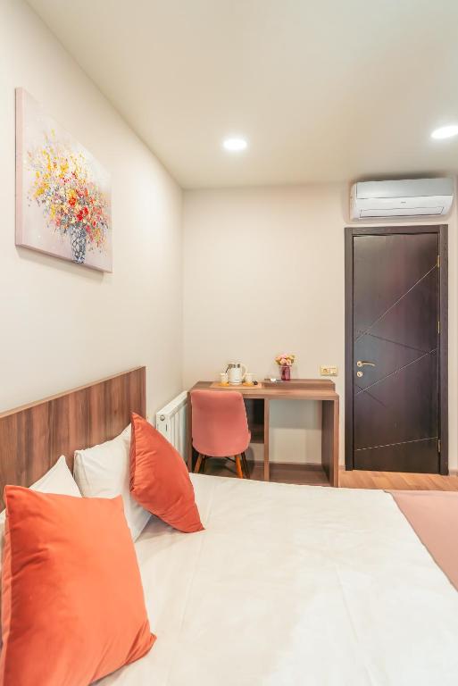 Postel nebo postele na pokoji v ubytování Hotel Classic Suites