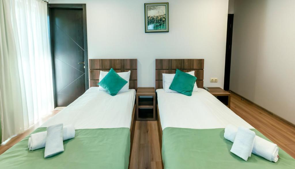 Postel nebo postele na pokoji v ubytování Hotel Classic Suites