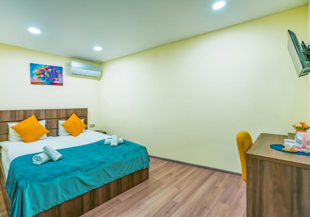 Postel nebo postele na pokoji v ubytování Hotel Classic Suites
