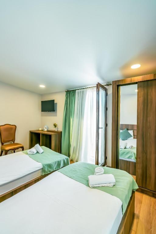 Postel nebo postele na pokoji v ubytování Hotel Classic Suites