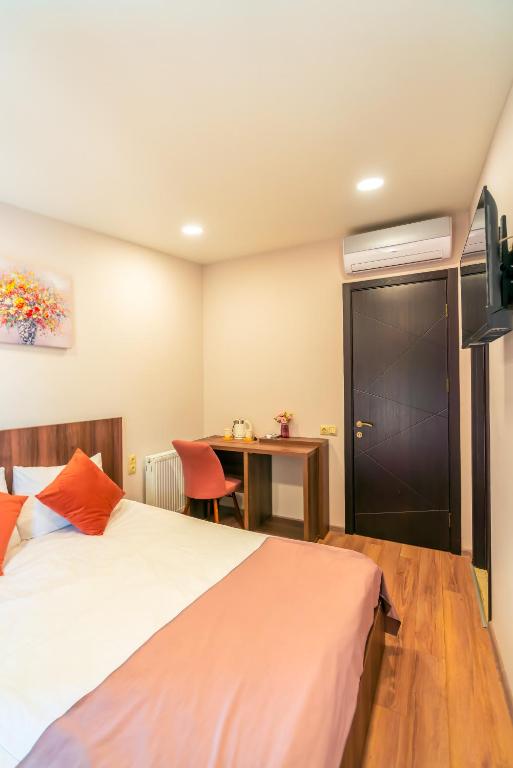 Postel nebo postele na pokoji v ubytování Hotel Classic Suites