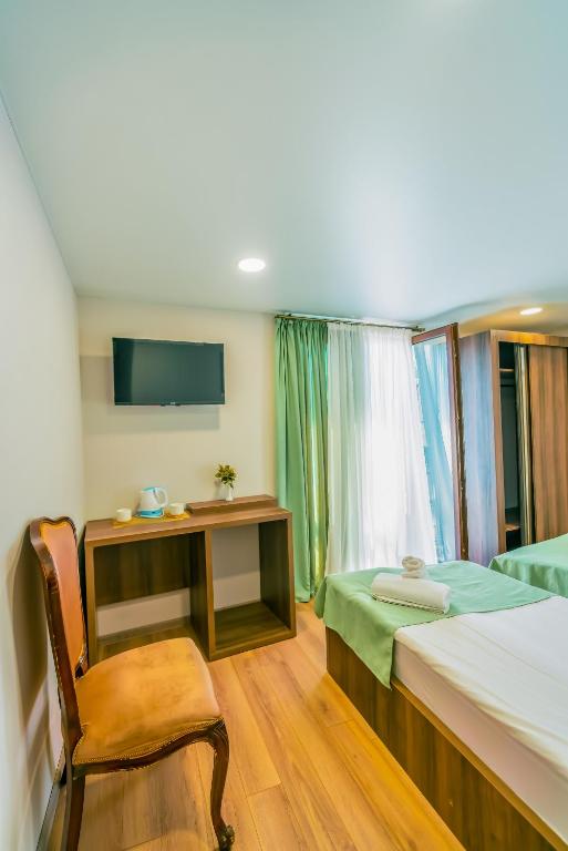 Postel nebo postele na pokoji v ubytování Hotel Classic Suites